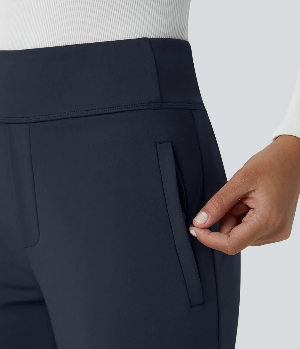 Pantalon Tailleur évasé à taille haute et poches laterales zippées