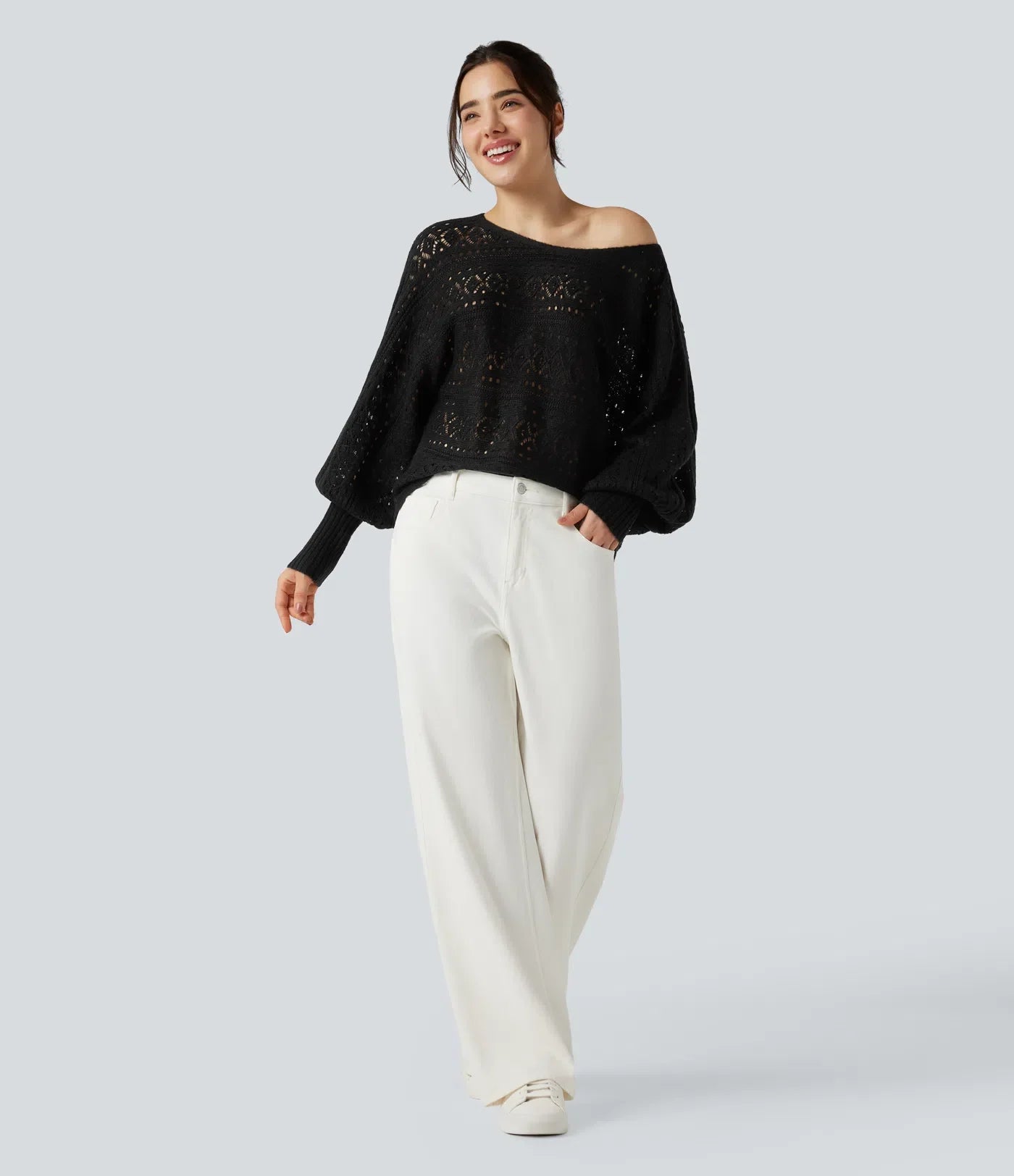 Załóż golf ajouré wokół długich spodni manches chauve-souris