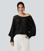 Załóż golf ajouré wokół długich spodni manches chauve-souris